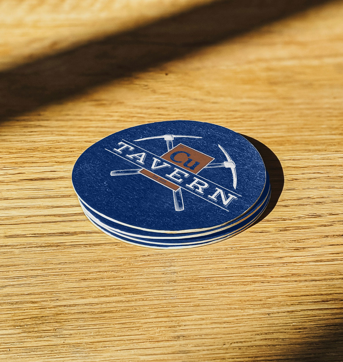 Cu Tavern logo on a coaster