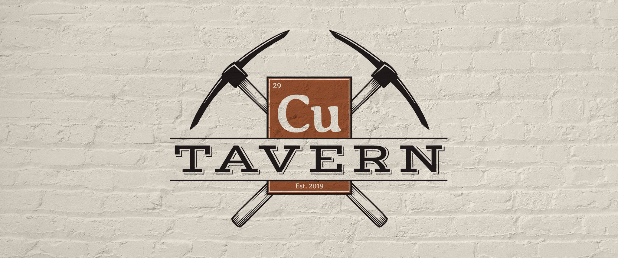 Cu Tavern Logo on a brick wall