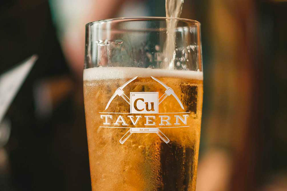 Cu Tavern Logo on a glass